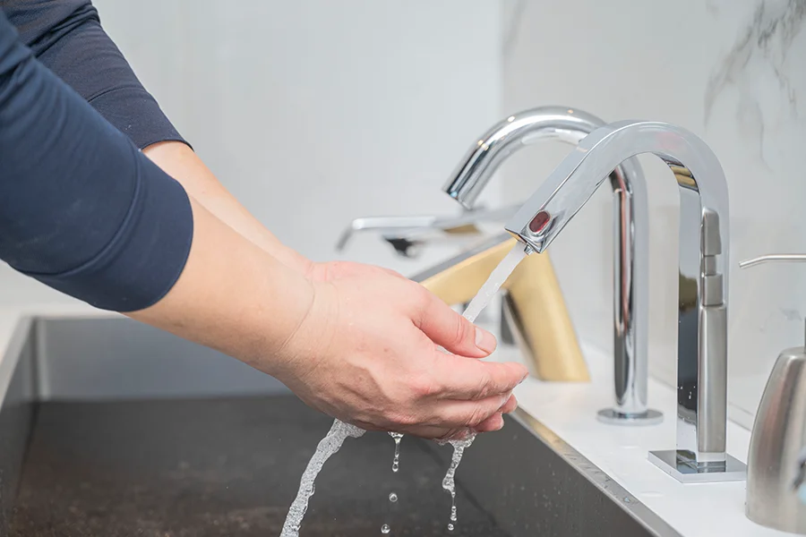 a man washing the hand 